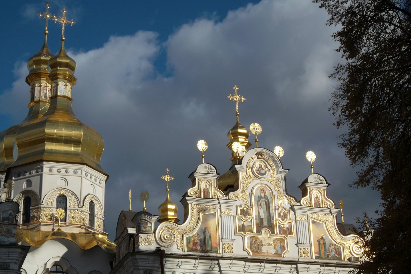 Ornate golden domes atop a historic Orthodox church.